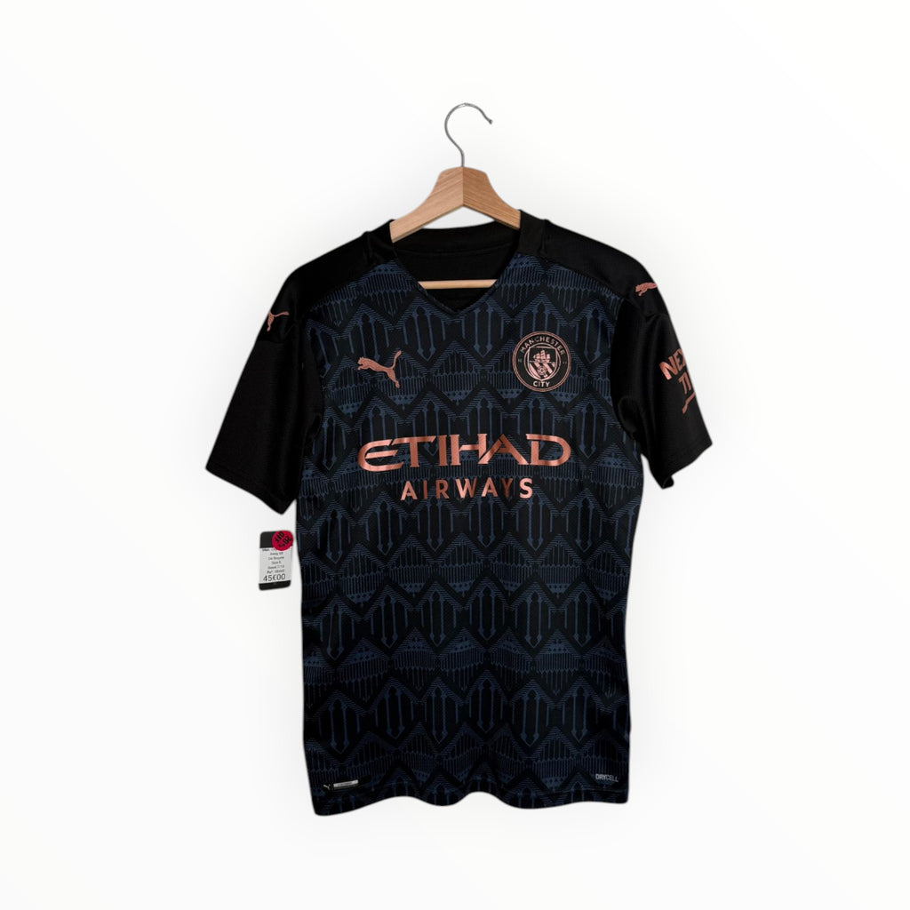 Black and bronze football shirt puma Manchester city