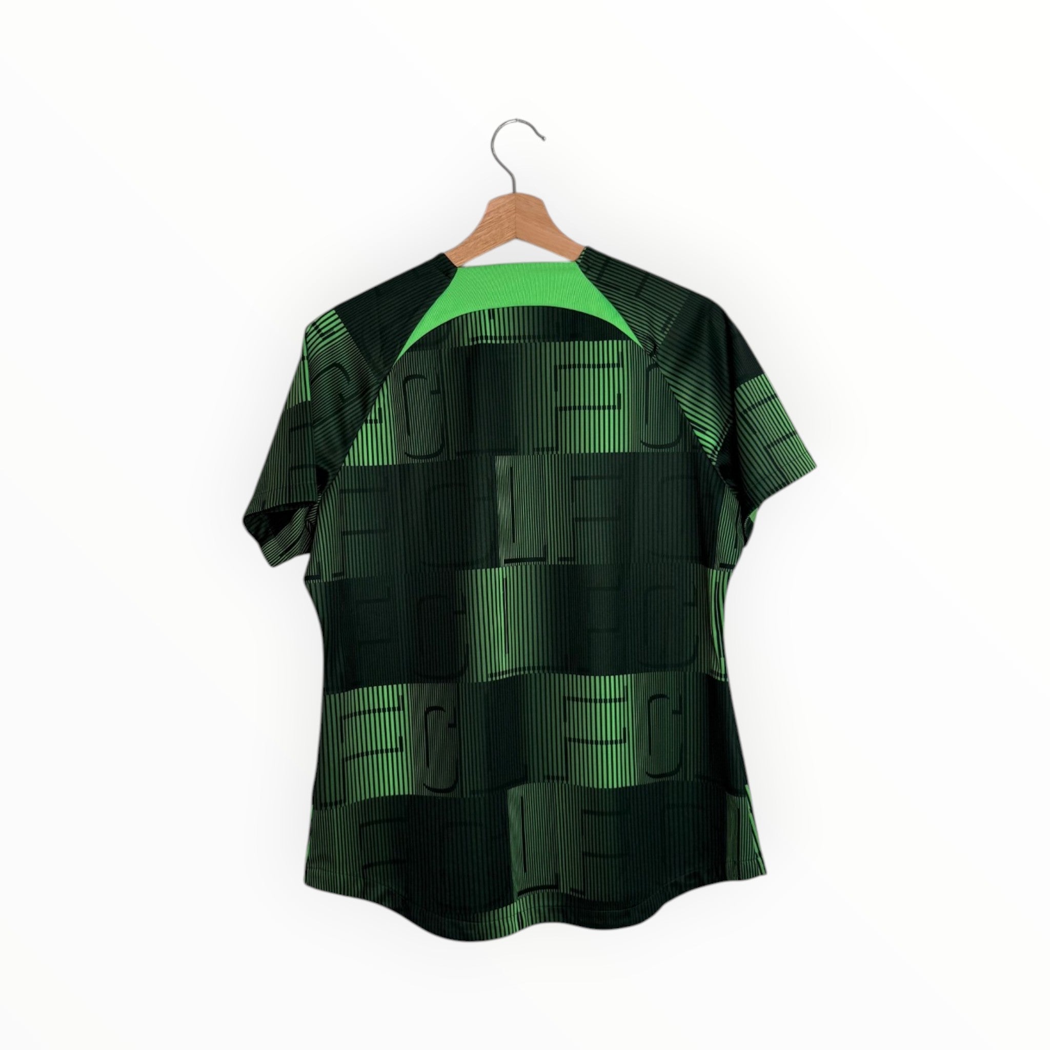 Black and green football shirt