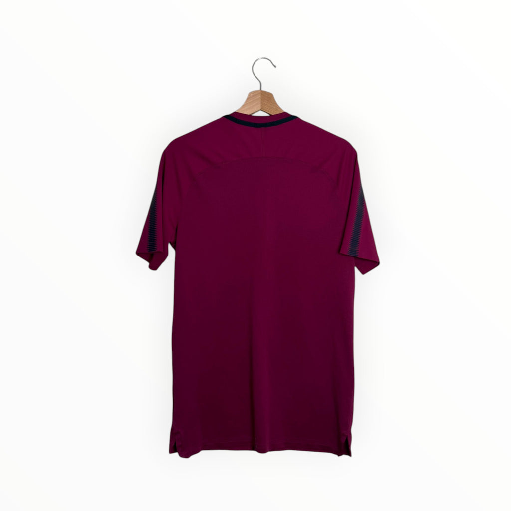 Dark red football shirt with black stripes