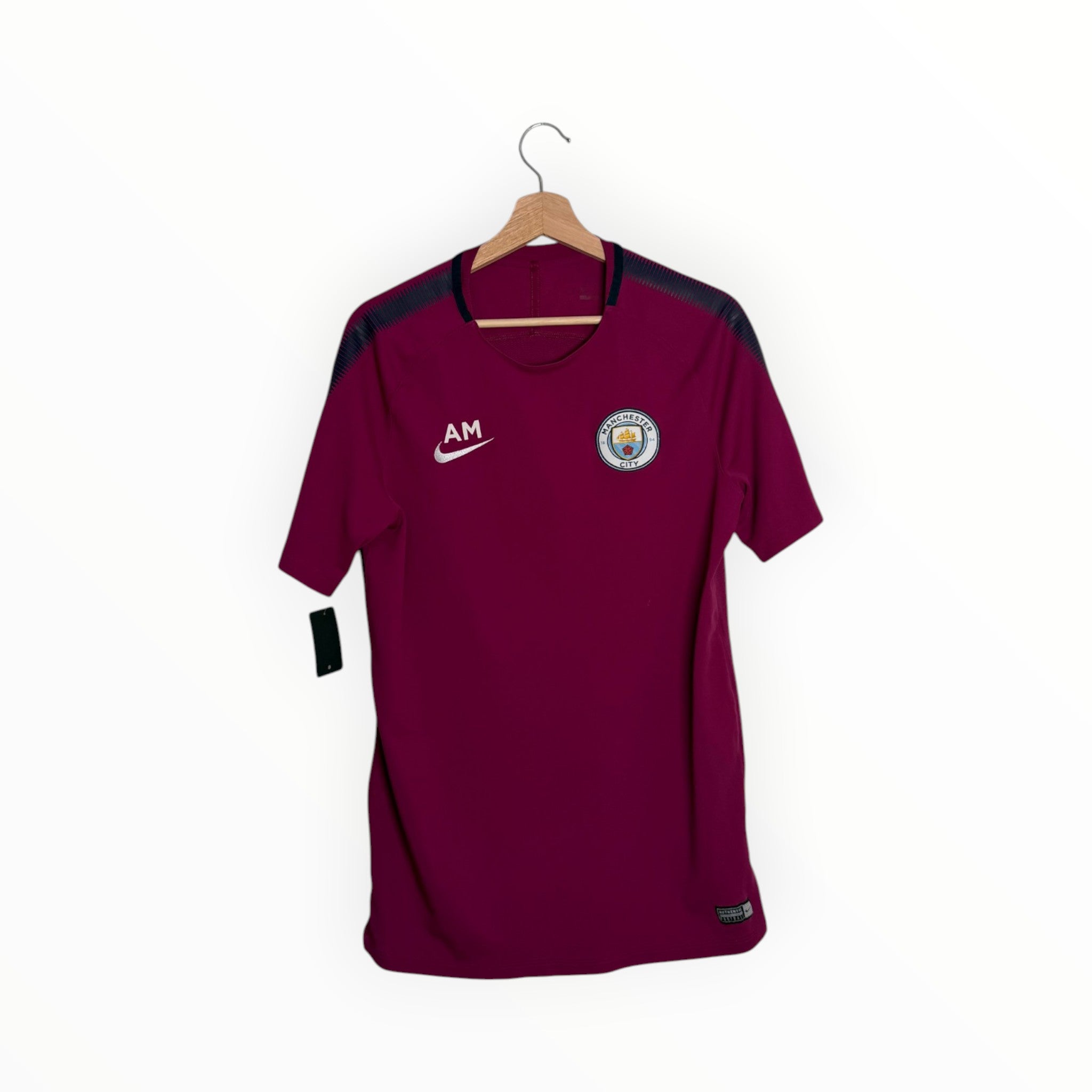 Dark red football shirt with black stripes nike Manchester city