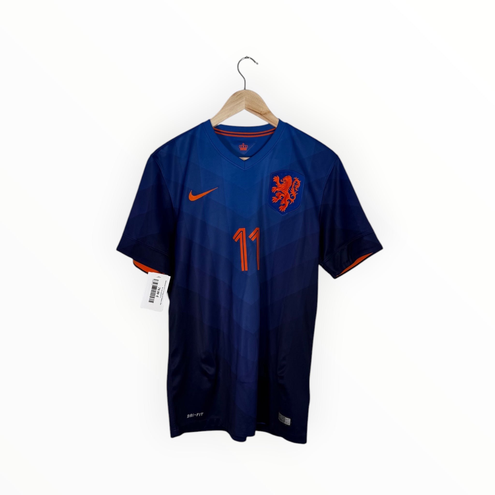 A dark blue Nike Netherlands soccer jersey with orange accents, hanging on a wooden hanger against a white background.