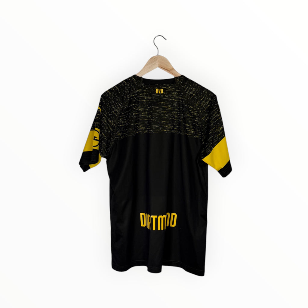 A black and yellow short-sleeve athletic t-shirt hanging on a wooden hanger against a plain white background. The shirt features a black and yellow textured pattern across the upper chest and shoulders, solid black sleeves with yellow accents, and 'DITTMID' printed in yellow on the lower back.
