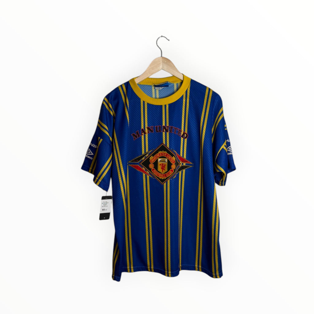 blue and yellow football shirt man united