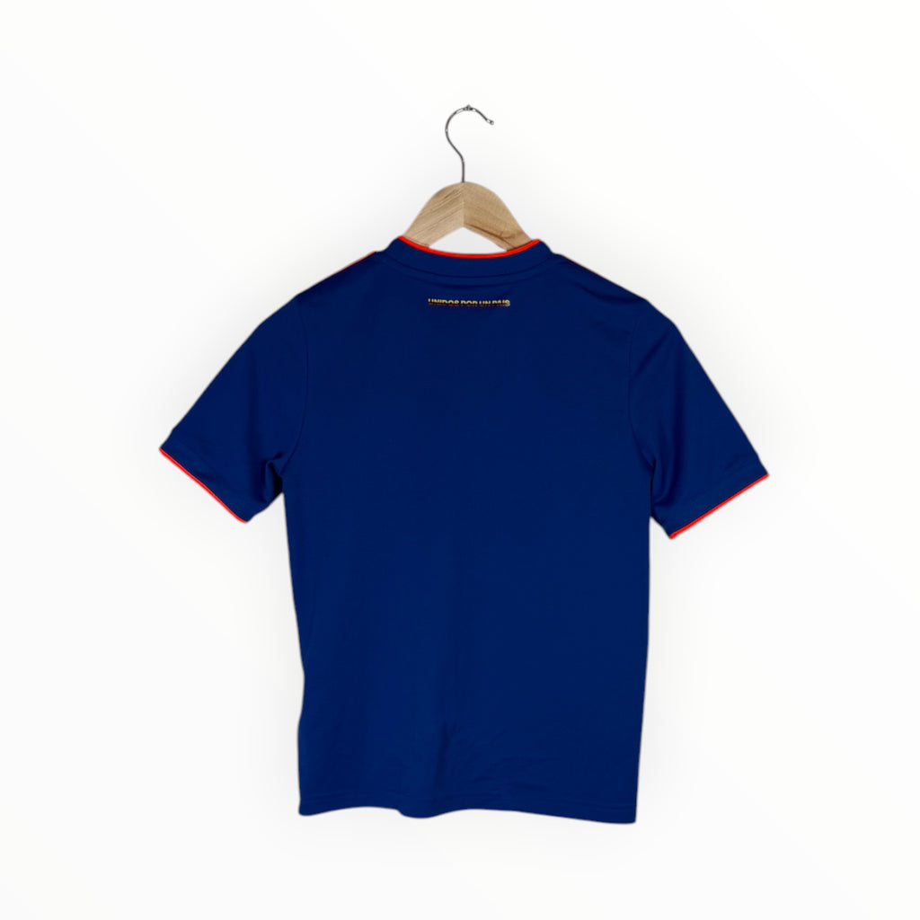 A navy blue short-sleeve t-shirt with red and yellow trim on the collar and sleeve cuffs, hanging on a wooden hanger against a plain white background.