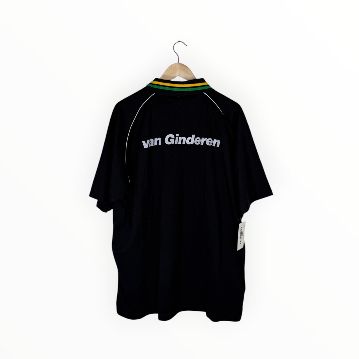 A black short-sleeve cycling jersey with 'van Ginderen' printed in white across the chest, hanging on a wooden hanger against a plain white background.