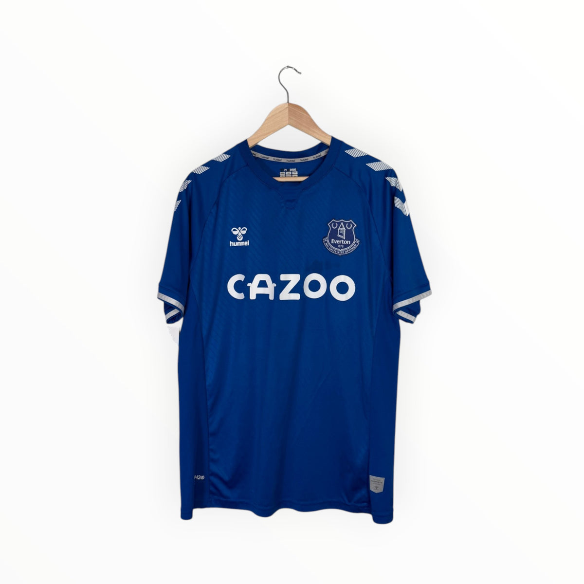 A blue short-sleeve soccer jersey hanging on a wooden hanger against a plain white background. The jersey features the Evian crest on the left chest, a white 'CAZOO' sponsor logo across the center, and white shoulder stripes.
