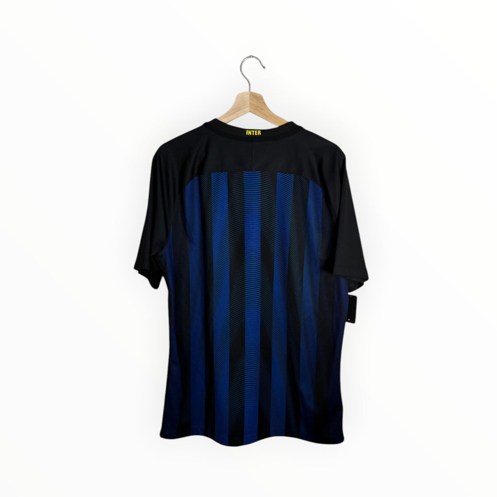 inter yellow on black and blue jersey