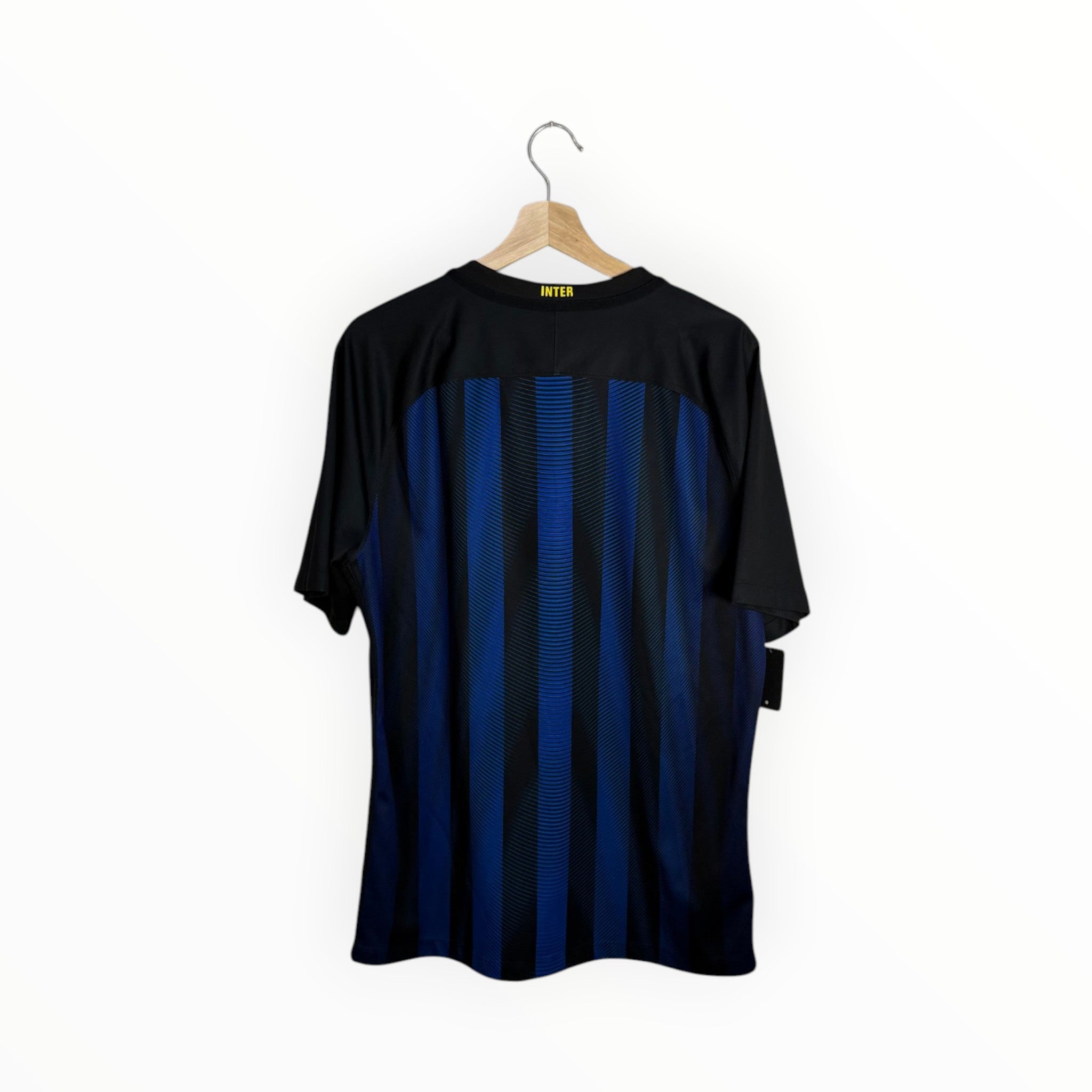 inter yellow on black and blue jersey