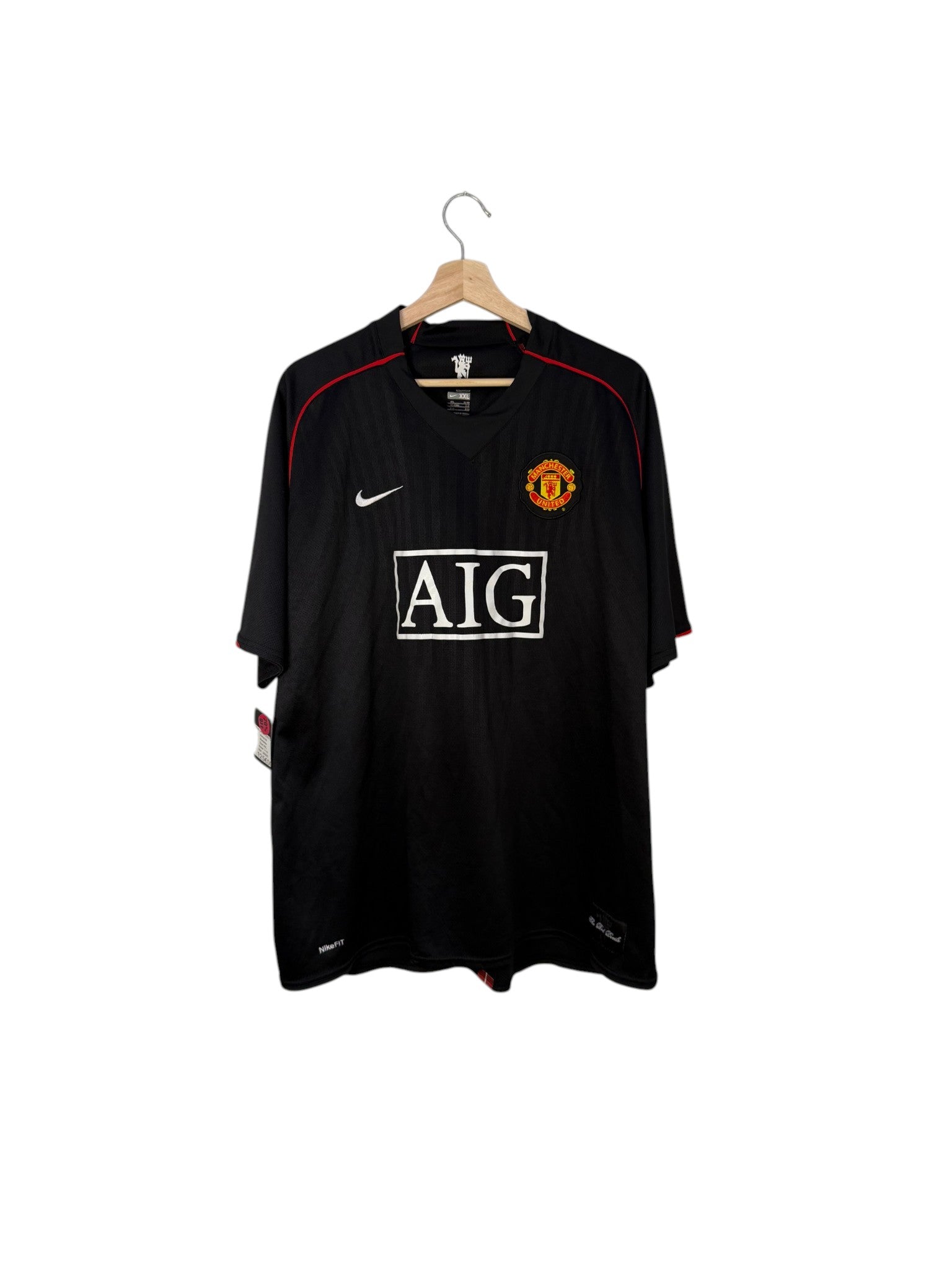manchester united football shirt black and white sponsor