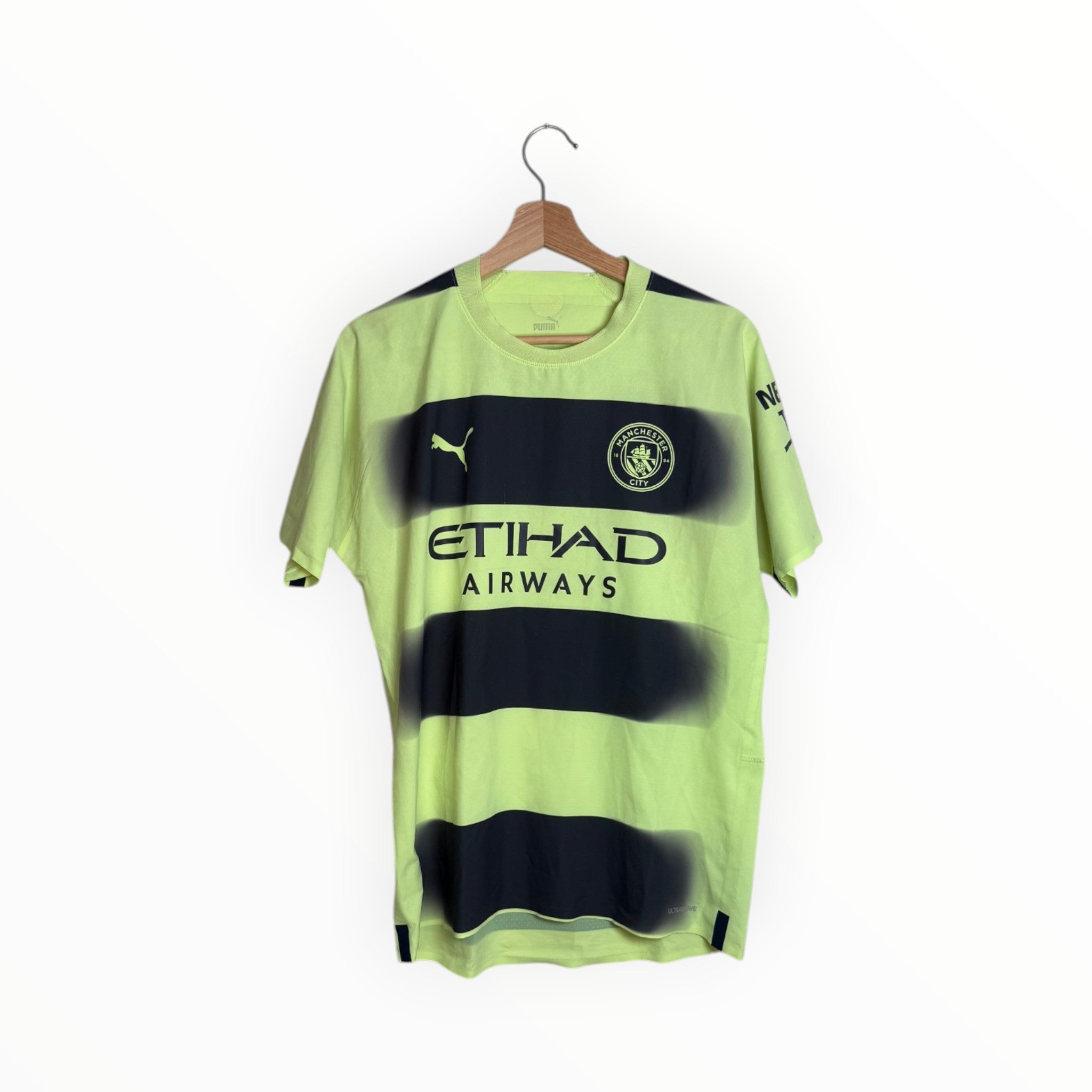 puma football shirt black and yellow man city etihad
