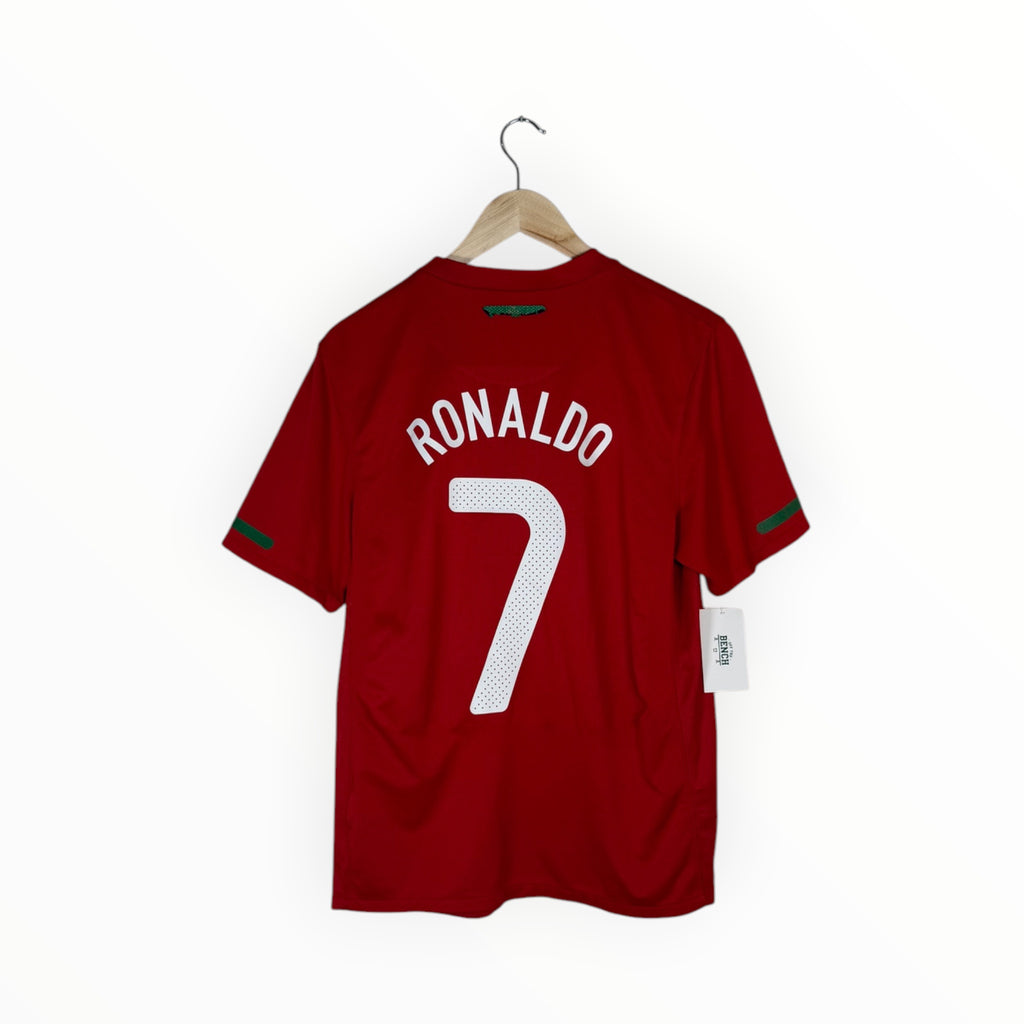 A red short-sleeve soccer jersey hanging on a wooden hanger against a plain white background. The back of the shirt features the name 'RONALDO' in white arched lettering above a large white number '7'.