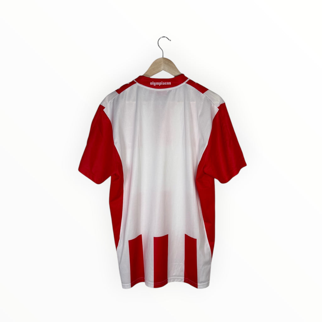 A red and white striped short-sleeve athletic jersey hanging on a wooden hanger against a plain white background.