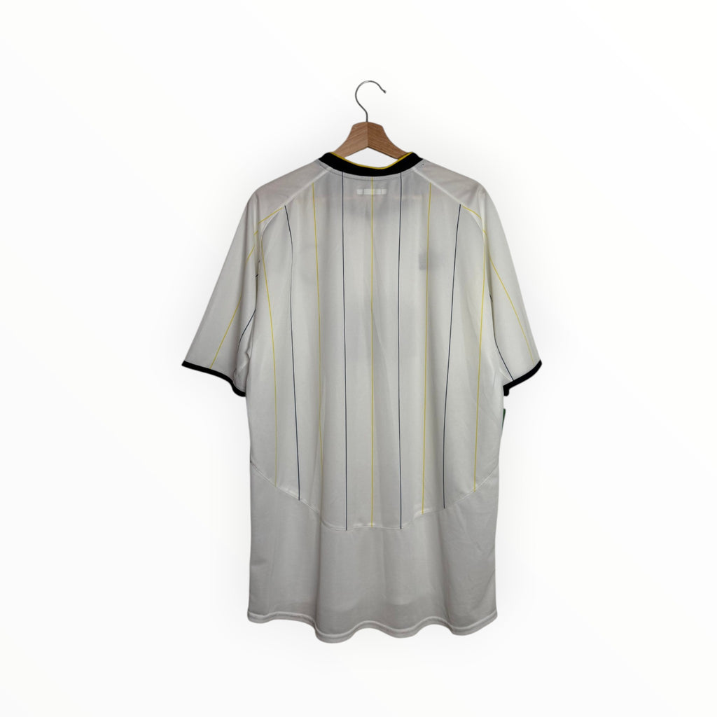 white football shirt leeds blue and yellow stripes